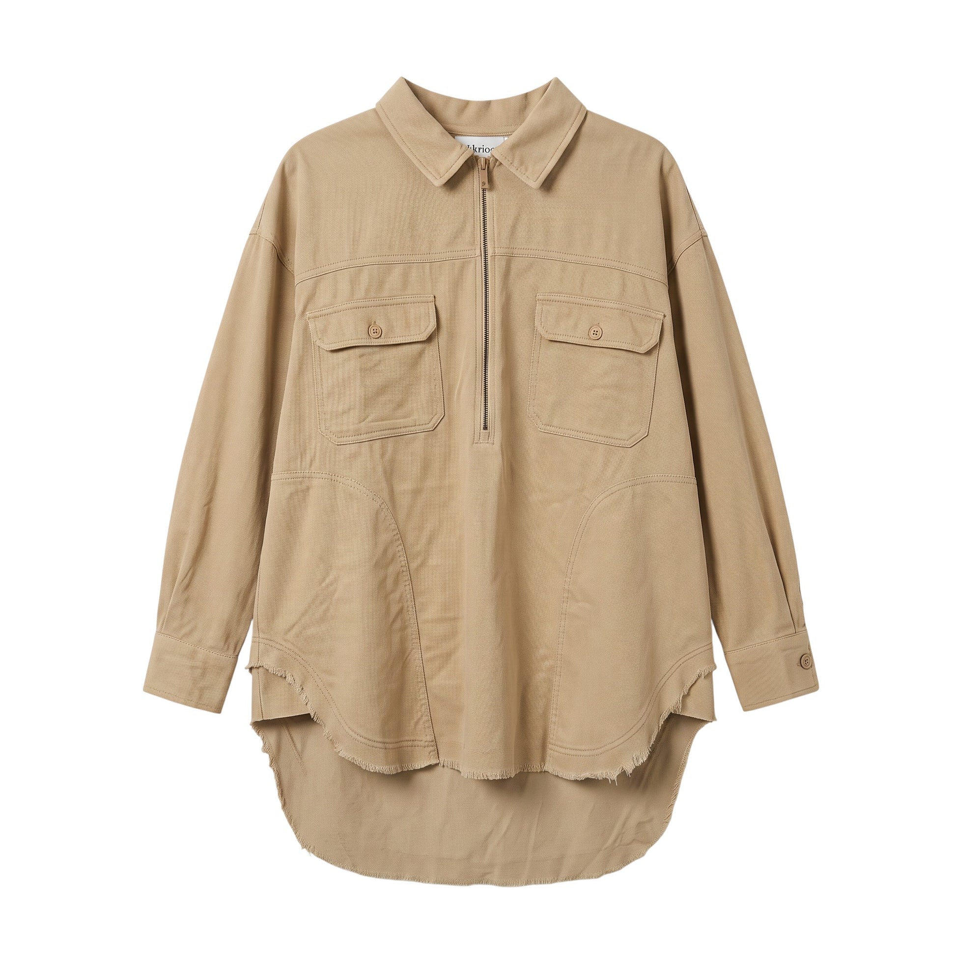 Creatively Chaotic Luxury Boutique beige oversized shacket with a half-zip front, chest pockets, and raw hem detail.
