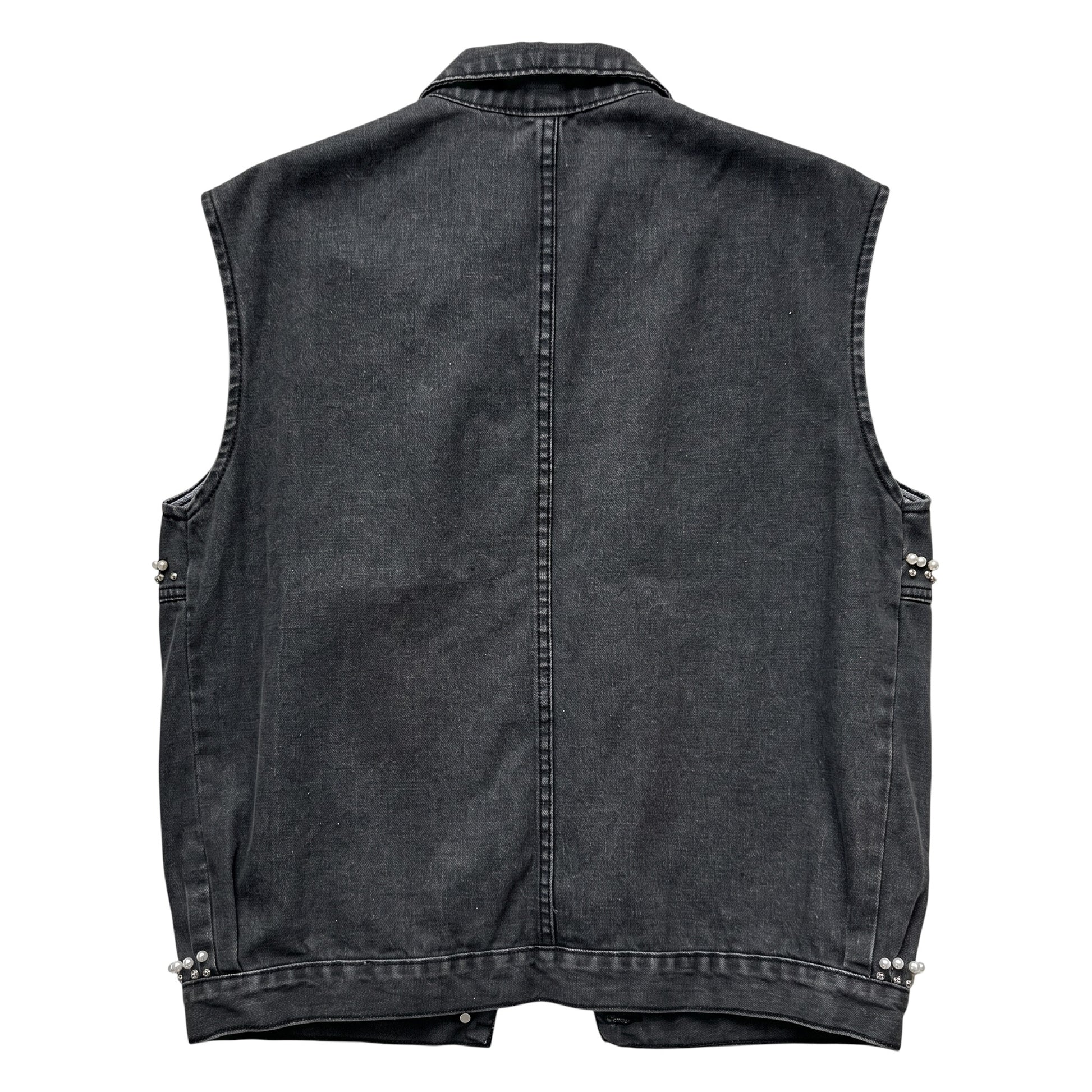 Back view of Creatively Chaotic Luxury Boutique washed black denim vest with pearl accents at the side hem