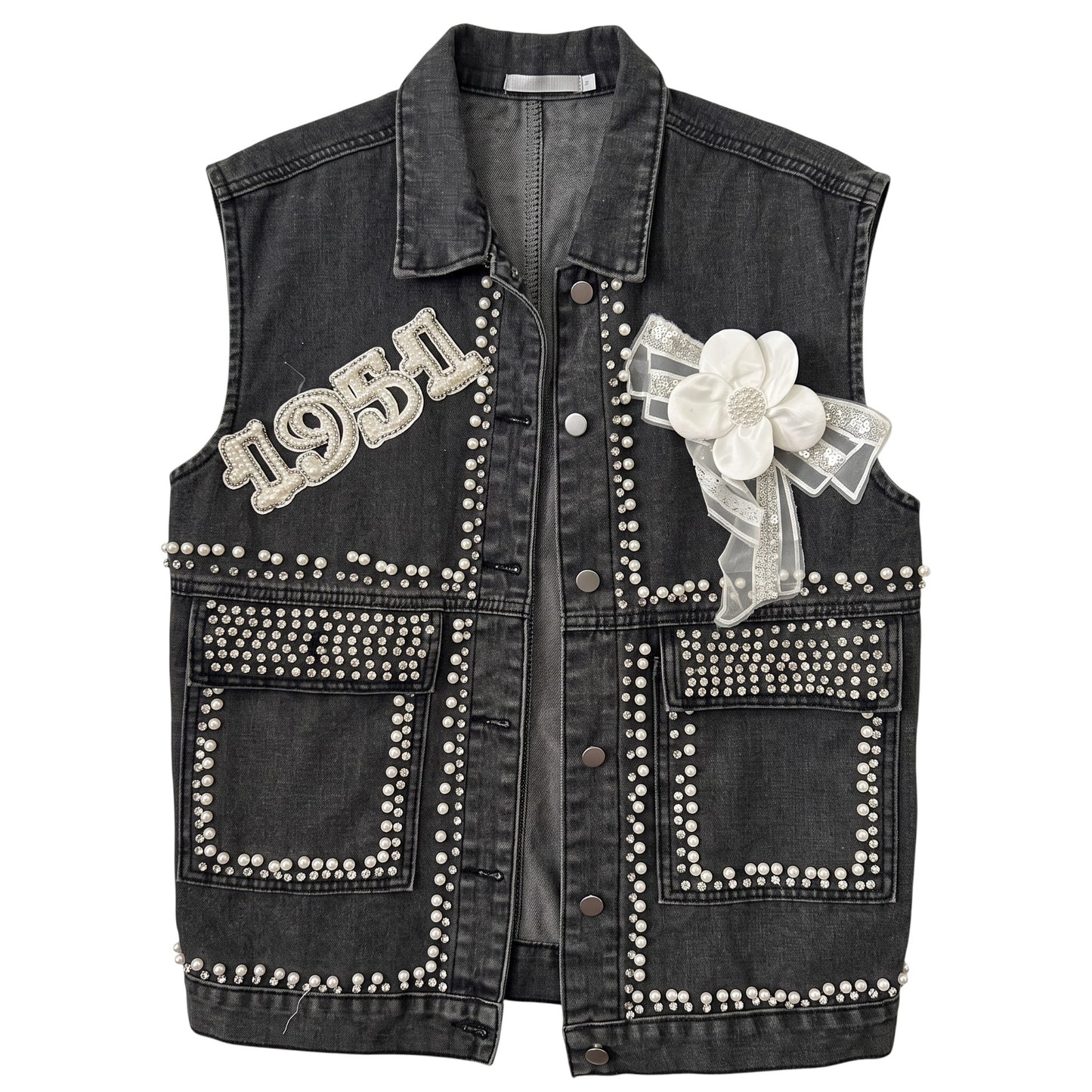 Creatively Chaotic Luxury Boutique washed black denim vest with crystal 1951 appliqué, faux pearls, and floral bow.