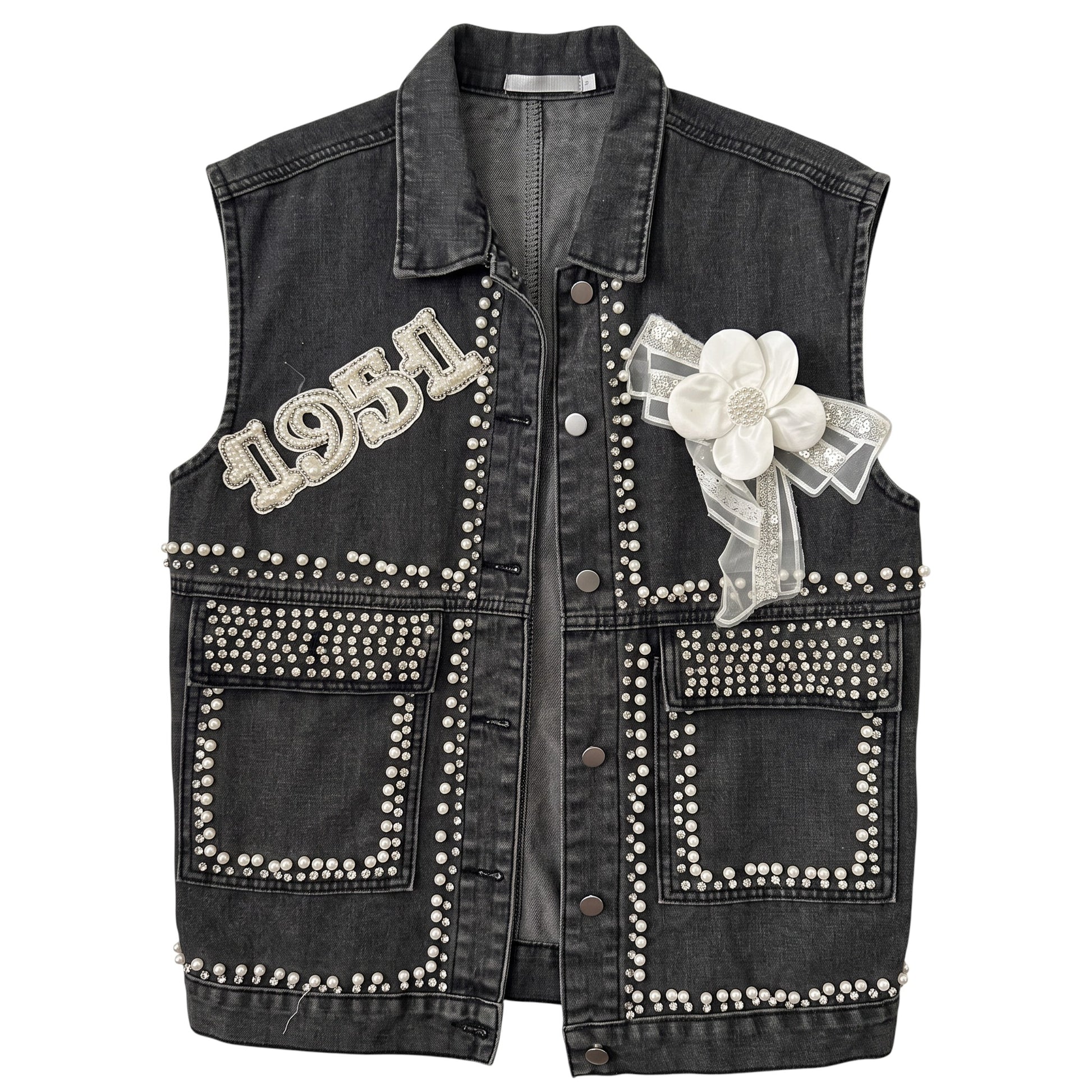 Creatively Chaotic Luxury Boutique washed black denim vest with crystal 1951 appliqué, faux pearls, and floral bow.