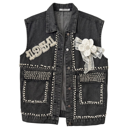 Creatively Chaotic Luxury Boutique washed black denim vest with crystal 1951 appliqué, faux pearls, and floral bow.