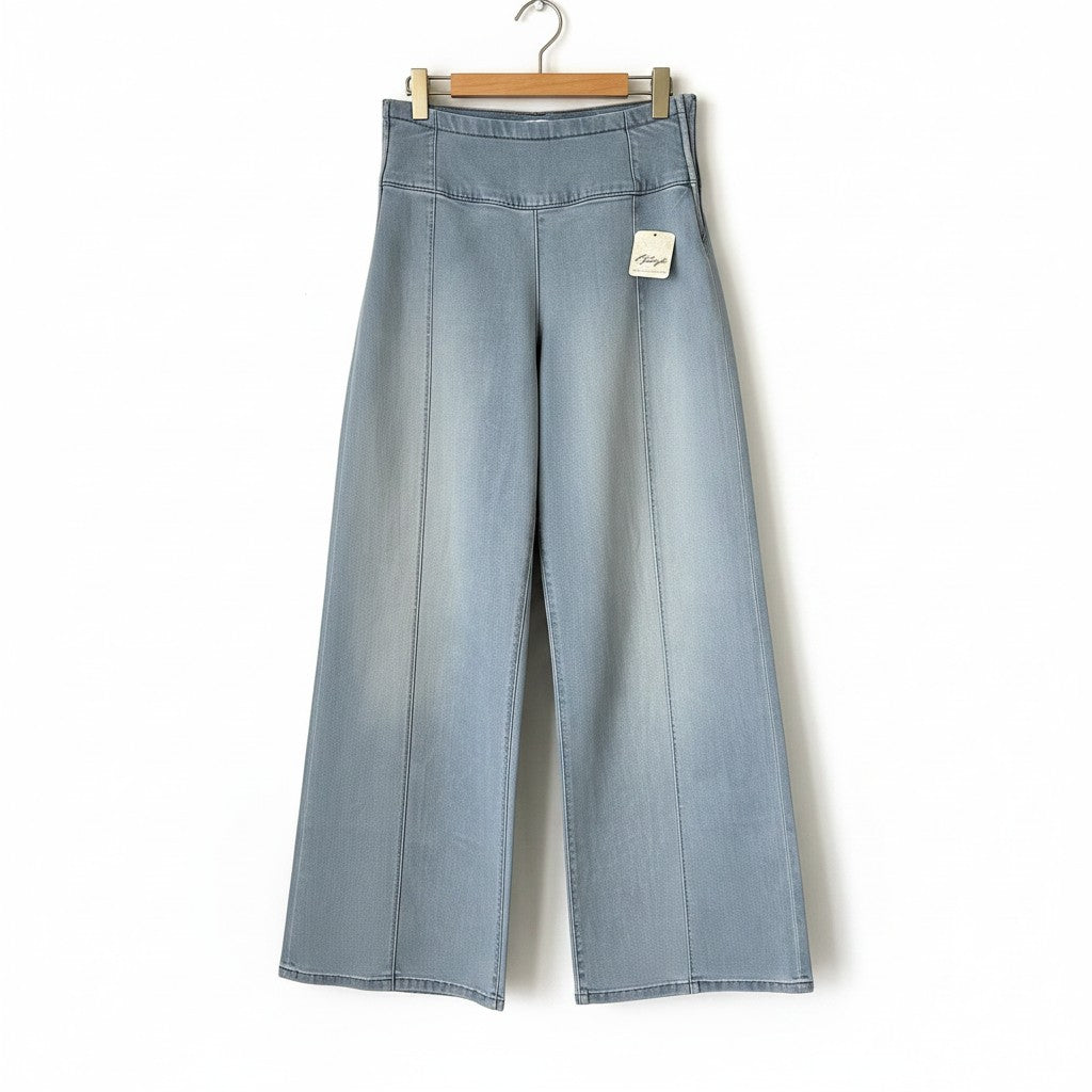 Creatively Chaotic Luxury Boutique Free People high-rise wide-leg jeans in a light blue faded denim wash.