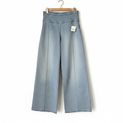 Creatively Chaotic Luxury Boutique Free People high-rise wide-leg jeans in a light blue faded denim wash.