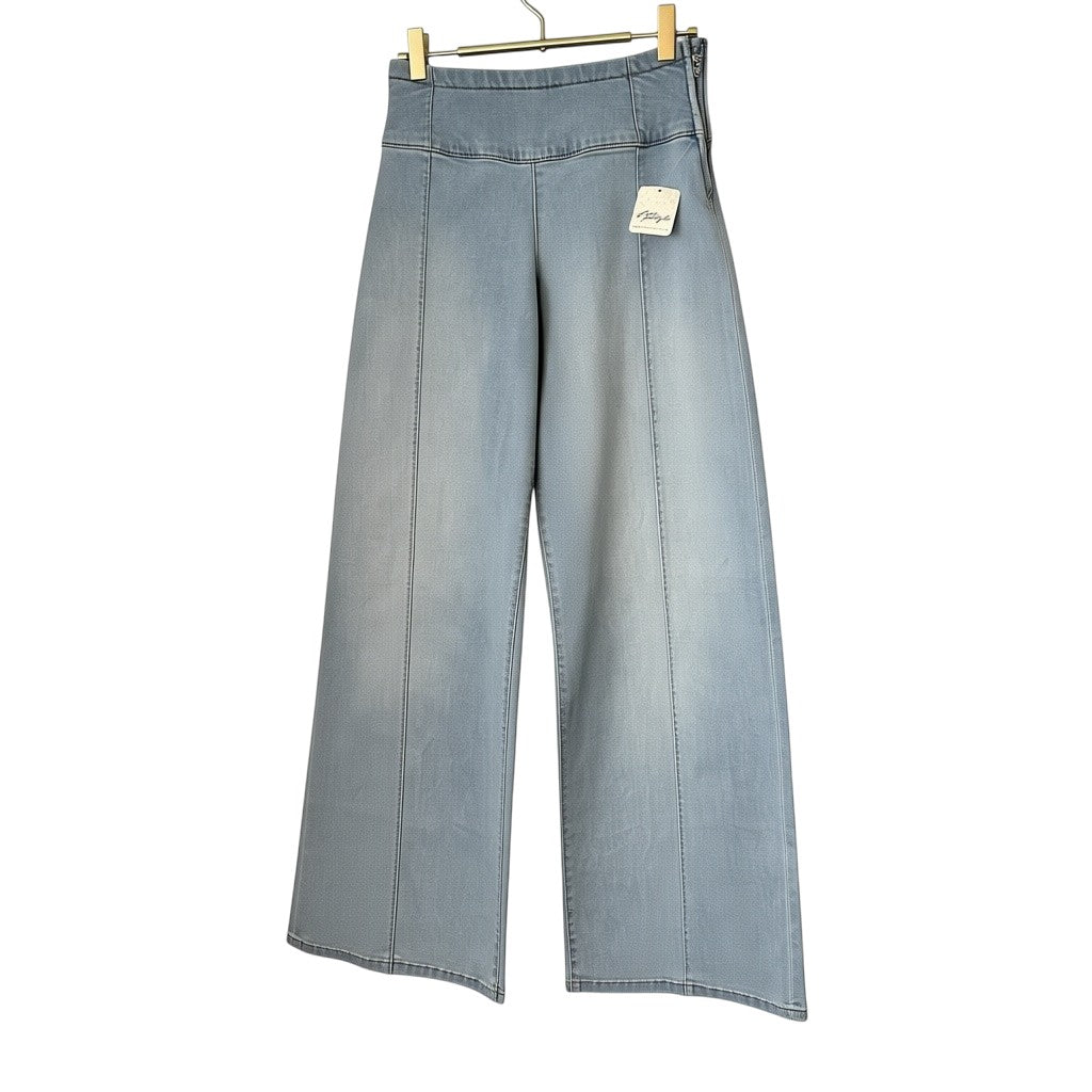 Creatively Chaotic Luxury Boutique Free People high-rise wide-leg jeans in light wash denim with front seam detail.